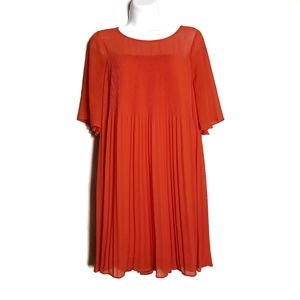 Maeve "Edie" orange pleated swing dress by Anthro
